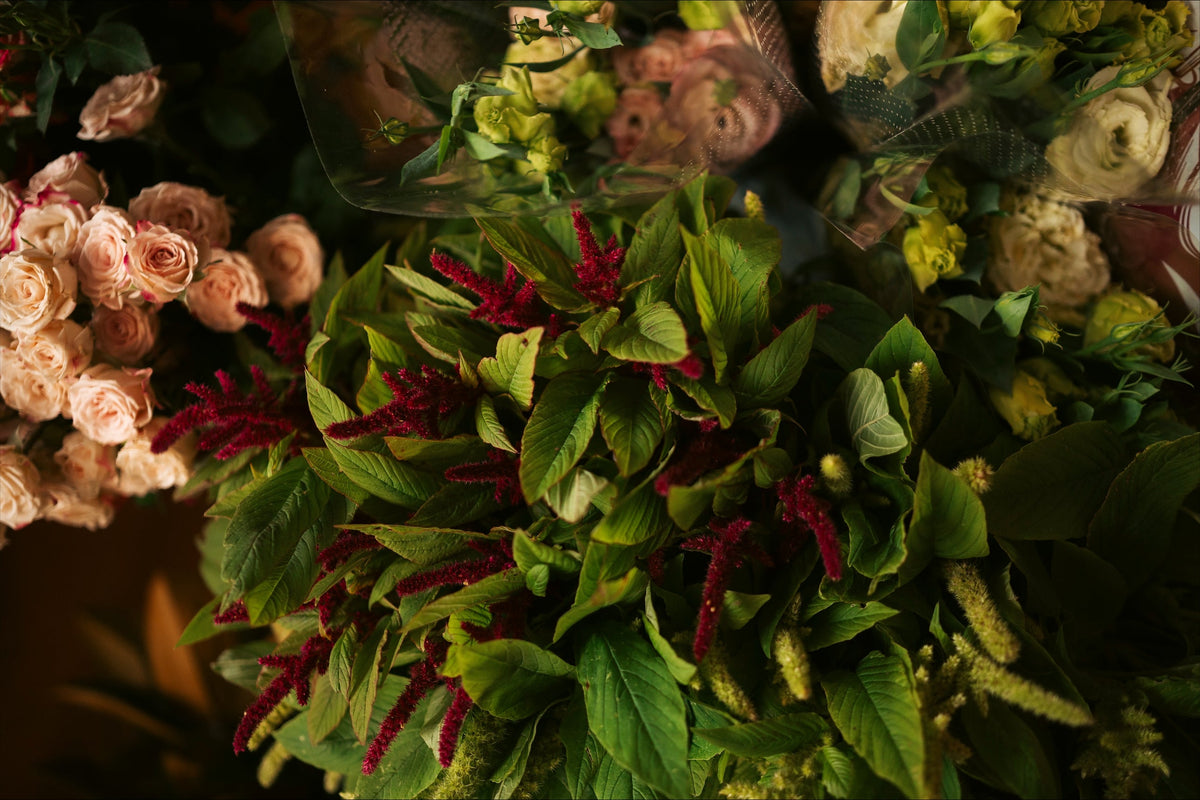 Green seasonal foliage and flowers